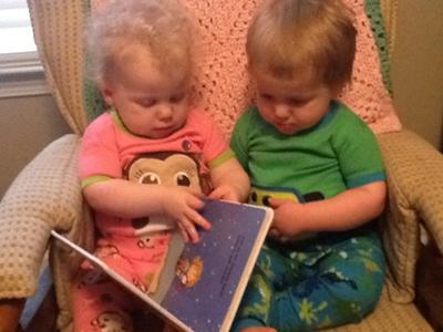 Grace & Griffin reading a bedtime story together.